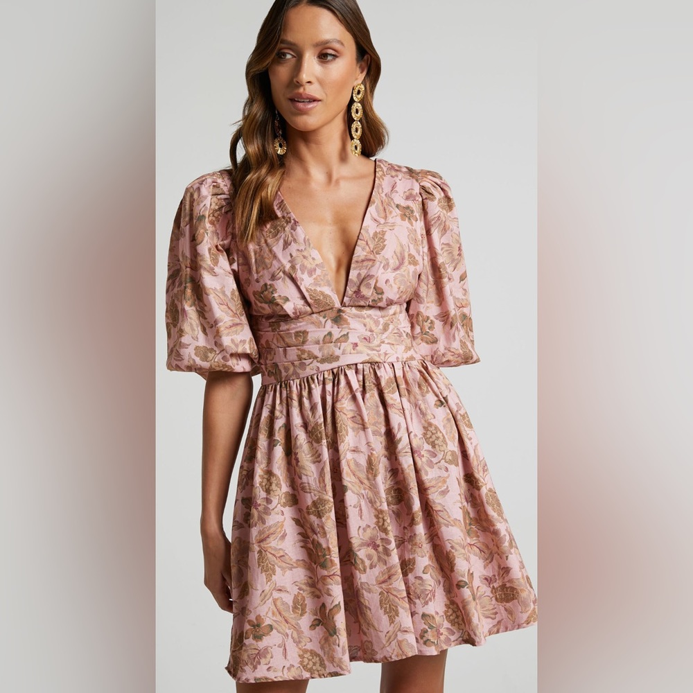 Amalie the Lable Floral Mini Dress. Puff sleeves, open back, and plunge neckline
